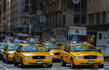 Yellow taxi cab on congested city street