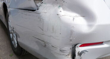 Rear bumper of car showing damage from a hit and run accident.