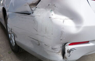 Rear bumper of car showing damage from a hit and run accident.