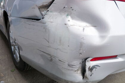 Rear bumper of car showing damage from a hit and run accident.
