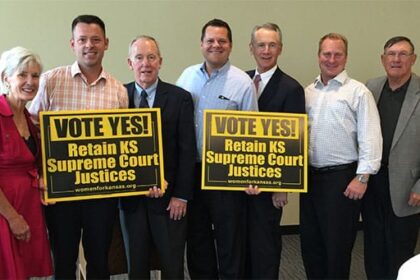 Dustin DeVaughn, Richard James and Cody Claassen of DeVaughn James Injury Lawyers meeting with Kansas Governors.