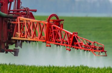 Roundup weed killer being sprayed on a field