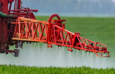 Roundup weed killer being sprayed on a field