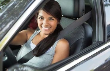 Female teen driver in car