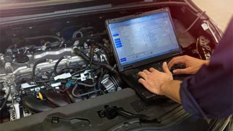 Car technician checking car data recorder Car technician checking car data recorder or EDR black box