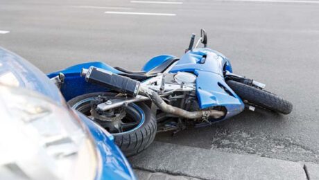 Motorcycle and Car Accident in Roadway