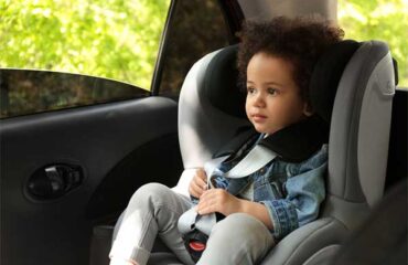 Young child in car seat.