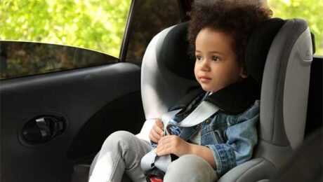 Young child in car seat.