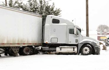 Wrecked Semi Truck in Snowy Ditch