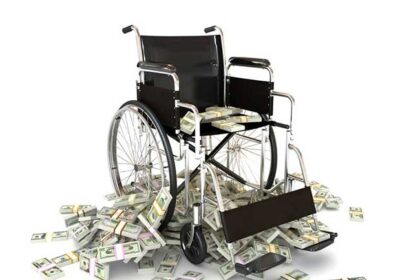 Wheelchair with pile of money indicating high medical costs