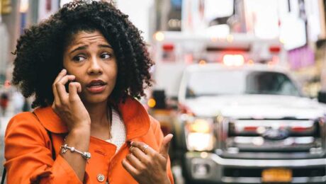 Woman on phone after car accident Woman on phone after car accident