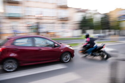 Motorcycle in city traffic near miss crash Motorcycle in city traffic near miss crash