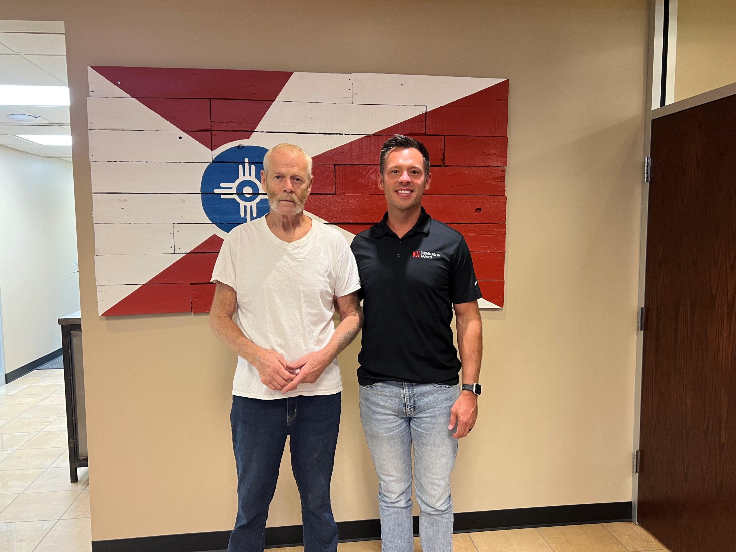 Attorney and DeVaughn James Partner Cody Claassen with happy client.