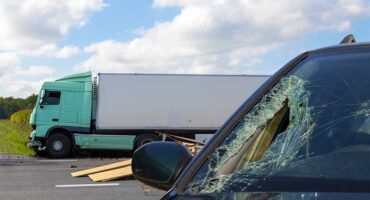 Semi-truck and car collision on Kansas roadway