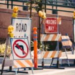 Various road construction and work zone signs.