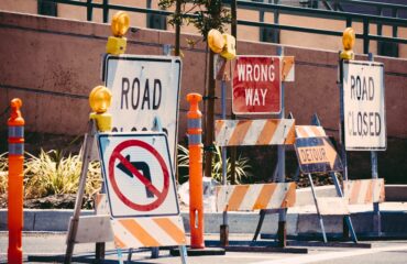 Various road construction and work zone signs.