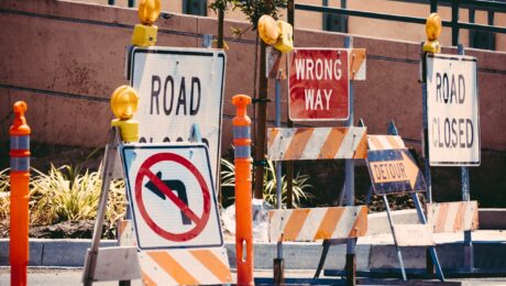 Various road construction and work zone signs.