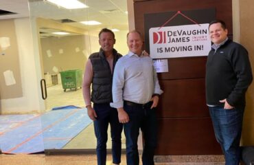 Attorneys Cody Claassen, Dustin DeVaughn, and Richard James posing outside their new law office in Kansas City, Kansas.