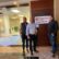Attorneys Cody Claassen, Dustin DeVaughn, and Richard James posing outside their new law office in Kansas City, Kansas.